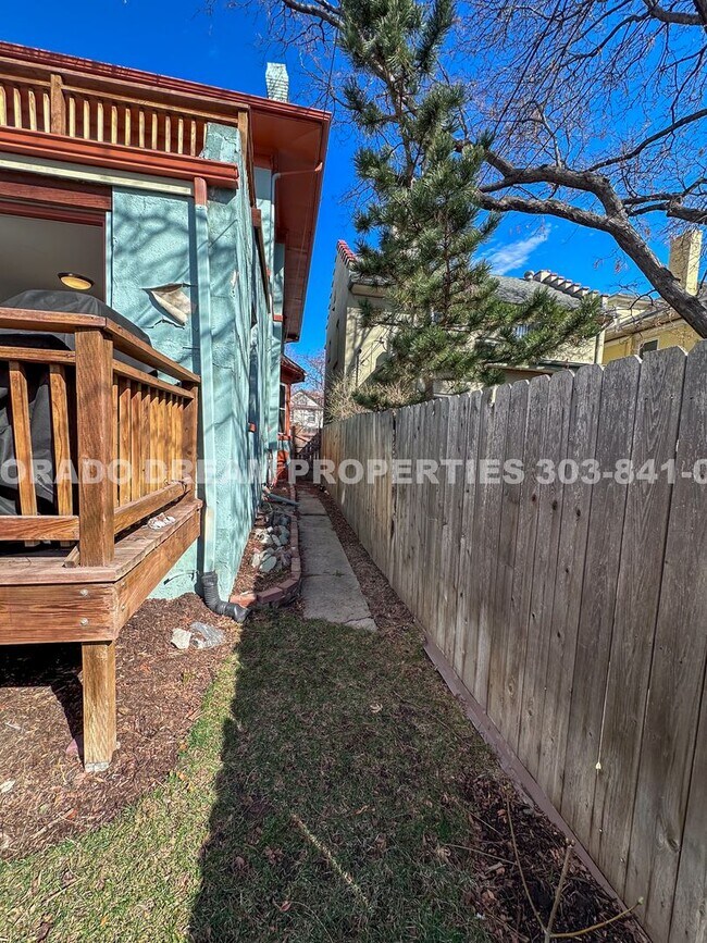 Building Photo - A home where old-world charm meets modern sophistication!