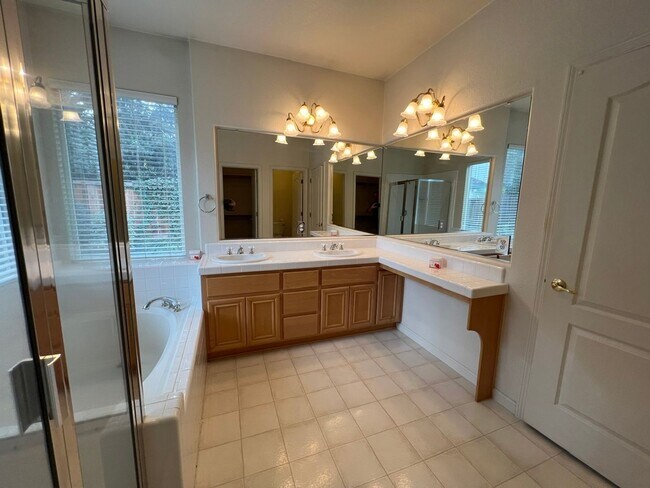 Building Photo - 4 bedrooms with 3 car garage in Rose Lane ...