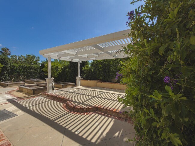Building Photo - Elegant Mediterranean Living with Private Pergola Garden & Resort Amenities
