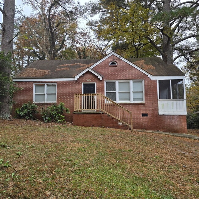 Primary Photo - Full brick 3 bedroom, 1 and half bath home with screened in side porch, and an attic for extra st...