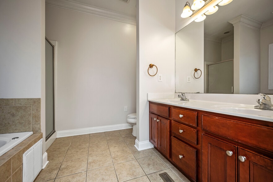 Double sink vanity, toilet and shower alcove - 393 Hays Blvd