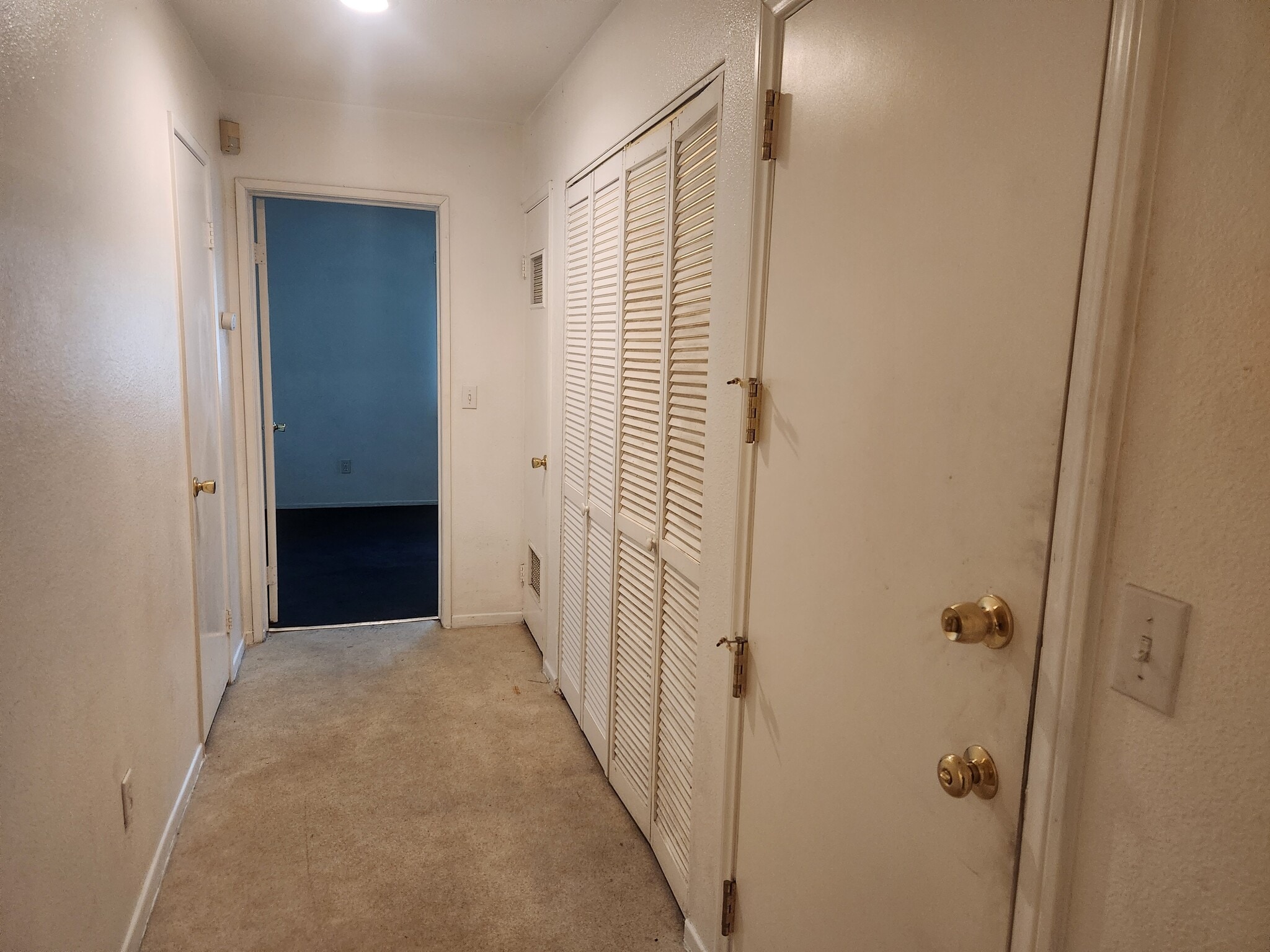hall to bdrm, patio, wd closet, and walk-in closet - 625 S Osage Ave