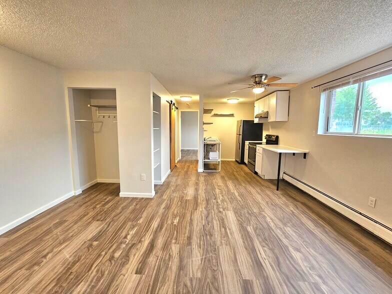 #102 LR onlooking Nook and Kitchen - 12th and Wads Residences