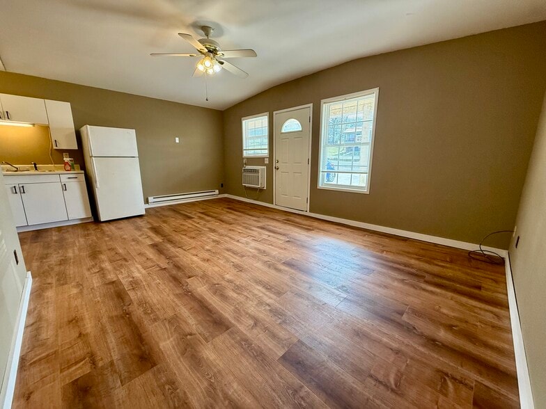 bright living room with A/C unit and fan - 377 AR 56 Hwy