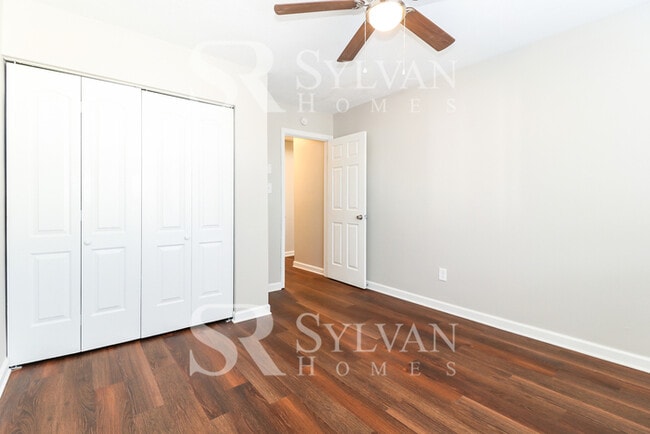 Building Photo - Venture outside to the expansive backyard,...