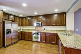 Building Photo - **Move in Special $1000 off 1st month's rent**Stunning 3-bed, 3.5 bath, tri-level condo w 2-car g...