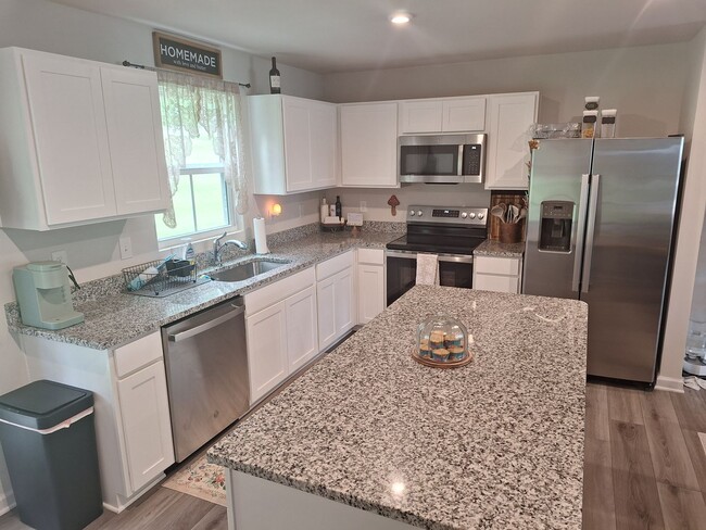 Building Photo - Outstanding Four Bedroom Home Less Than 10...