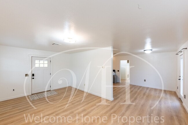 Building Photo - Comfortable 3-Bedroom Home with Fenced Yard and Attached Carport