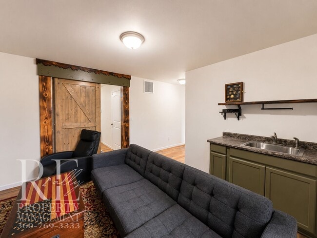 Building Photo - Spacious 3-Story Home with Flexible Living Space, Heat Pump & Private Deck Retreat