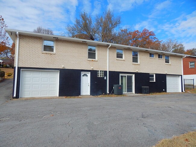 Parking and Garage/Basement Entrance (Unit B is left of middle downspout) - 1404 Winthorne Drive