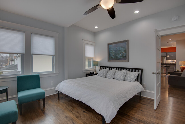 Master bedroom with private bath. We've replaced the blinds with light blocking curtains. - 3020 Columbus Ave