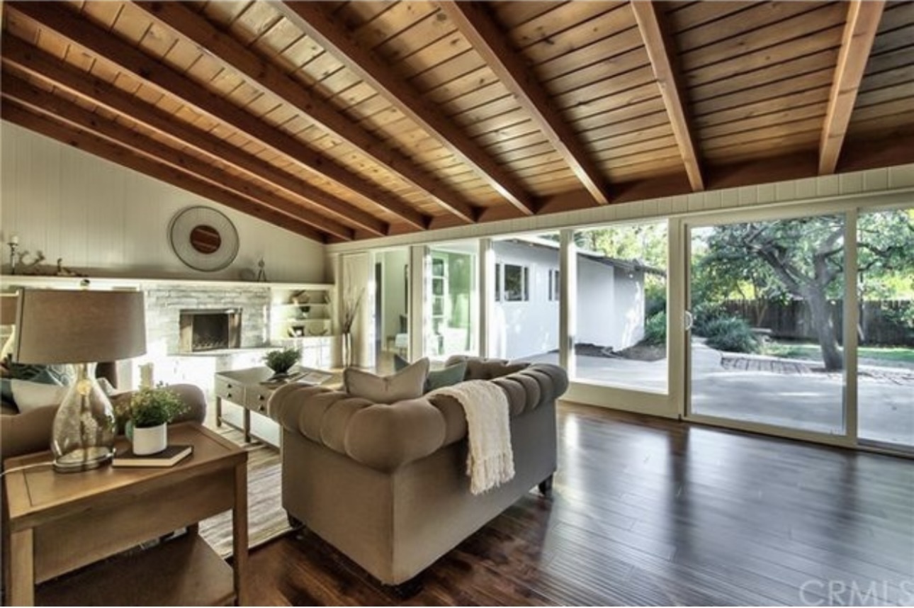 Warm entry opens to spacious living & dining with rich wood beams and natural light - 332 E Deodar St