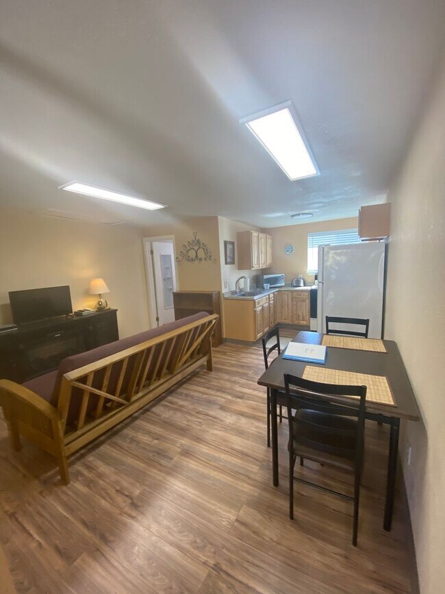 Building Photo - Adorable studio with large garage and work...