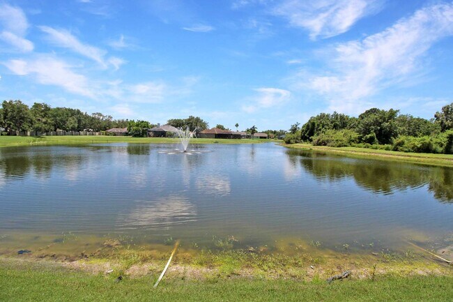 Building Photo - Annual rental: Spacious 3BR/2BA Creekwood Home with Office, Screened Lanai, EV Charger & Resort-S...