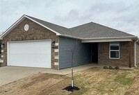 Building Photo - One Level/Four Bed/Two Bath/Two Car Garage...