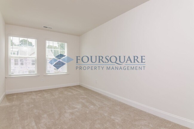 Building Photo - Charming End Unit Townhome With Back Patio...