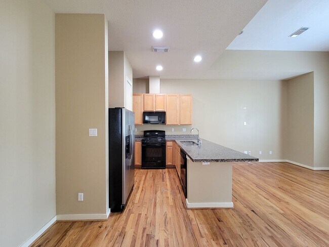 Building Photo - Elegant Gated Townhome Offering Unparallel...