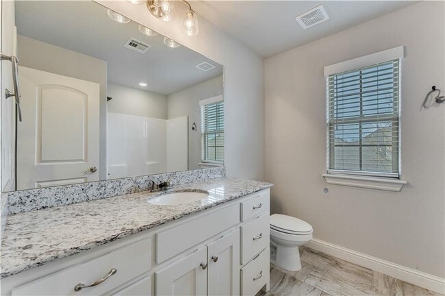 Building Photo - Minutes from I-49! 4BR/2.5BA Home