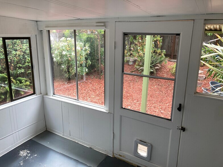 enclosed porch right behind laundry room, exits into yard - 436 Anderson St