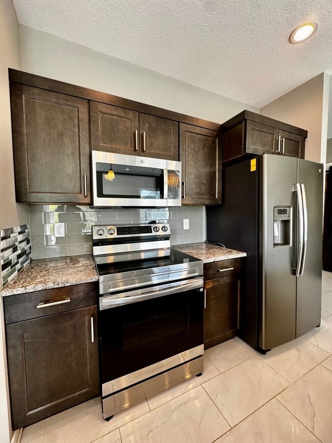 Building Photo - For Rent Beautiful 4 bedroom 3 bathroom 3 attached car garage!