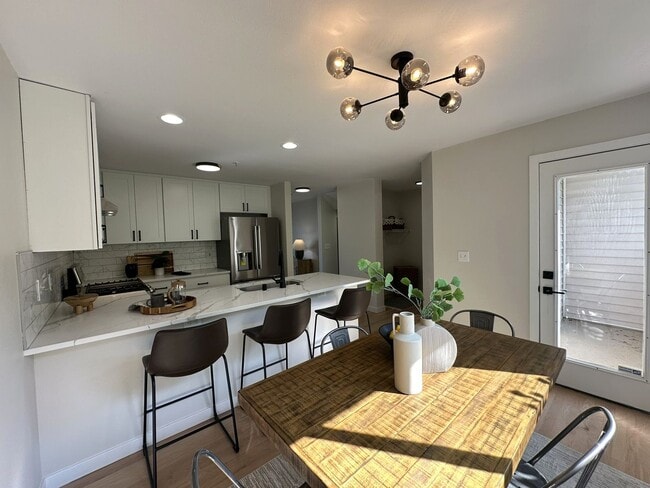 Building Photo - Updated 3-Story Condo with Balconies in So...