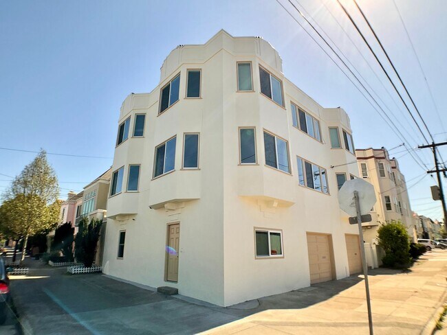 Building Photo - Remodeled! GARAGE PARKING Included! IN-UNI...