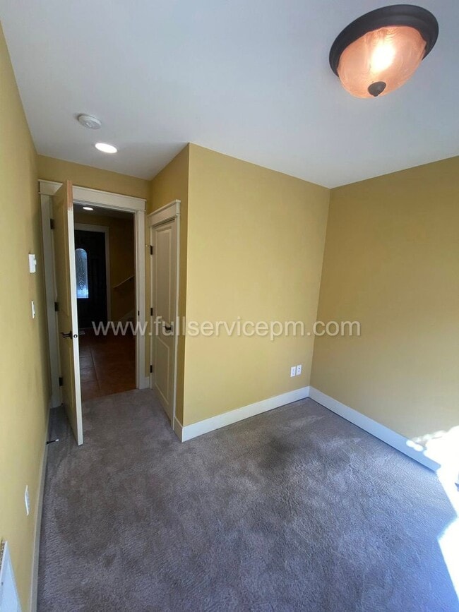Building Photo - Spacious townhome with private backyard, garage parking, multiple decks, and a dedicated home off...