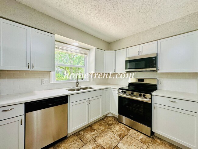 Building Photo - Updated Raytown Ranch w/ Wood Floors, SS Appliances, Finished Basement and a Fenced Yard!
