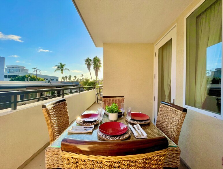 Sunny, peaceful balcony with palm tree views and coastal breeze. - 3687 4th Ave