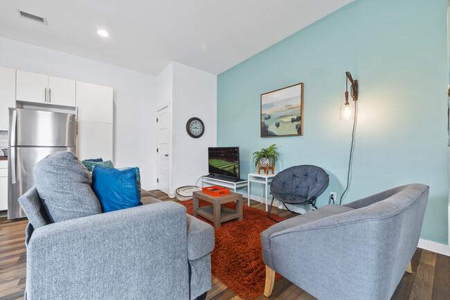 Open living room with lots of comfy seating & smart TV for entertainment - 906 Allene Ave SW