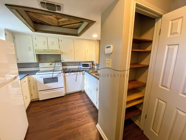 Building Photo - 2-Bed 2-Bath Home with Fenced Backyard – A...