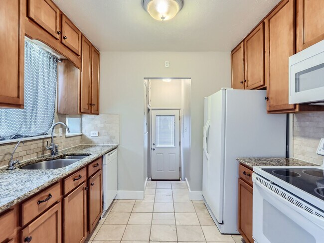 Building Photo - Evolve Real Estate: Available 8/8/26 Brick Tudor with Large Yard and Finished Basement!