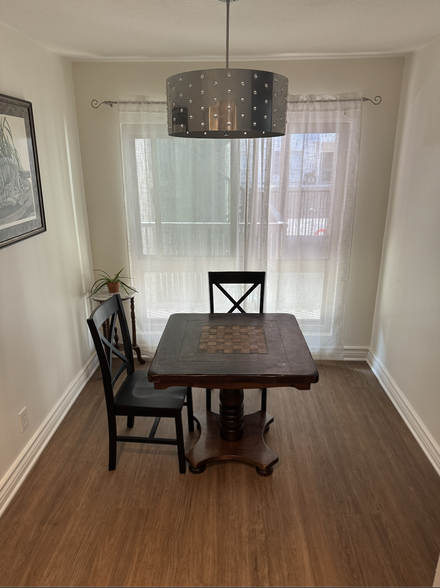 Dining area next to kitchen. - 6001 Canterbury Dr