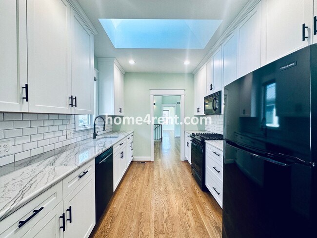 Building Photo - Charming Home Near Country Club Plaza w/ Gorgeous Updates, Wood Floors and a Two Car Garage!