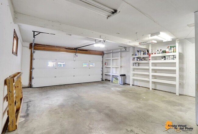 Building Photo - Eagle River Home w/ Fenced Yard, Sunroom, and Garage!