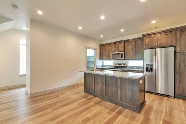 Building Photo - Modern End Unit townhouse w attached 2 car...
