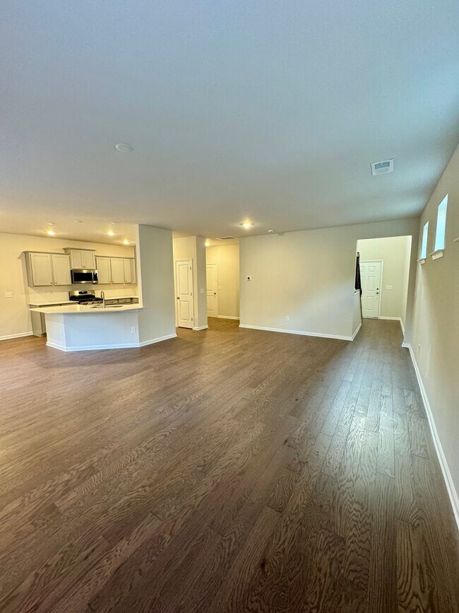 Building Photo - 4BR/2.5BA in Steel Creek's Brightwater Neighborhood