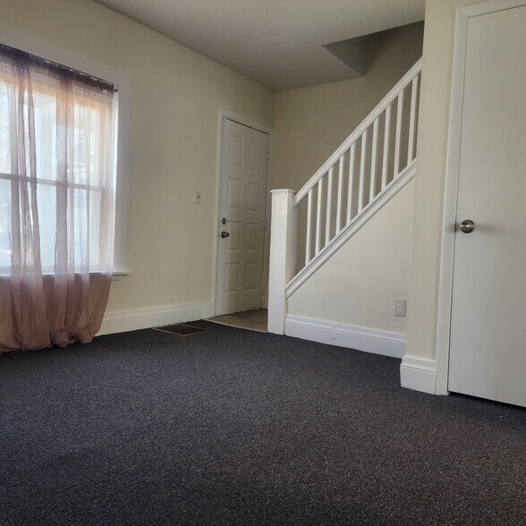 Living Room w/ coat closet - 113 Sterling St