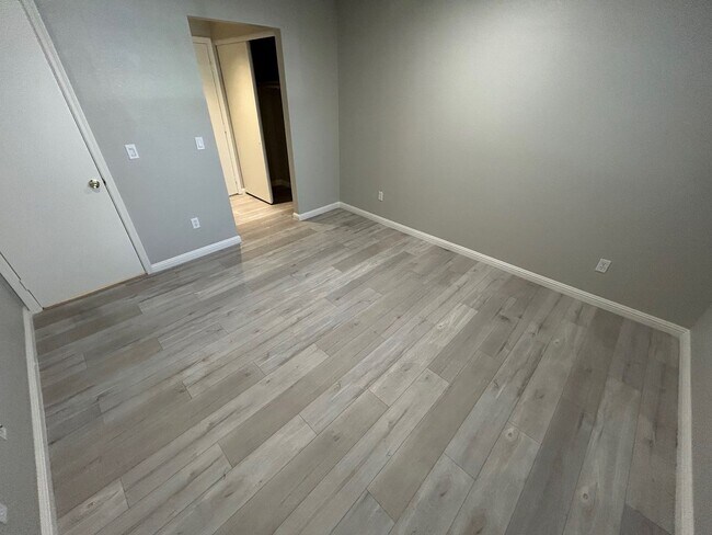Building Photo - INVITING 2 BEDROOM TOP FLOOR CONDO IN A CE...