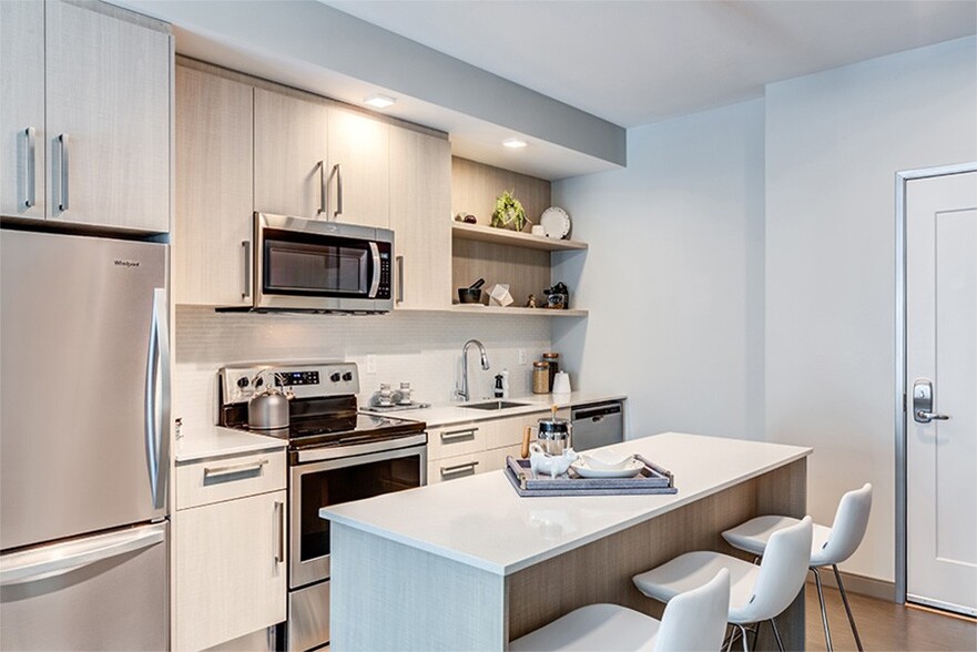 Contemporary kitchens with custom Italian-made cabinetry and open shelving - Velo Forest Hills Apartments