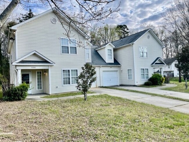 Building Photo - Must see this 4 bedroom 2.5 bath townhouse with 1 car garage .