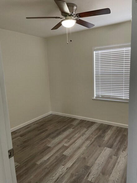 Flooring is now brand new natural color wood - 4257 N Bellflower Blvd