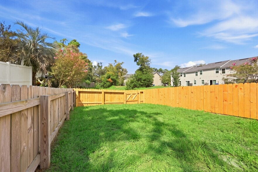 Fully fenced backyard with both grassy and paved areas to enjoy. - 3622 Caroline Vale Blvd