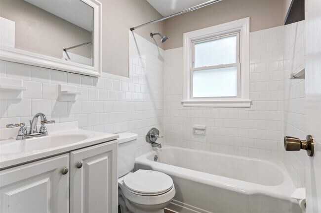 Building Photo - Charming brick rancher with modern kitchen...