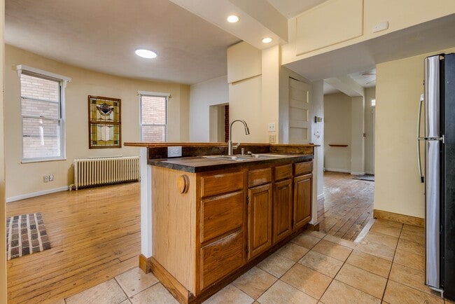 Building Photo - AVAILABLE June 2026 - Beautiful 4 Bedroom, 2 Bath Home w/ Front Porch Swing!