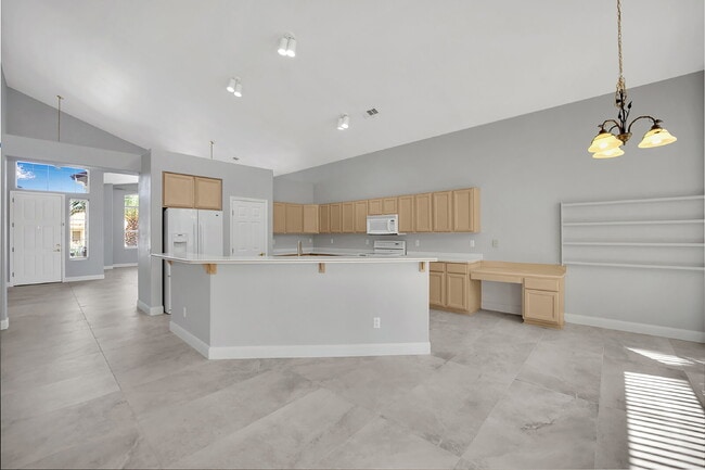 Building Photo - Spacious 4-bedroom, 3-car garage home feat...