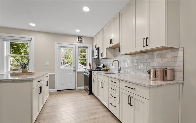 Building Photo - Updated 3BR Catonsville Townhome | Rear Parking + Deck