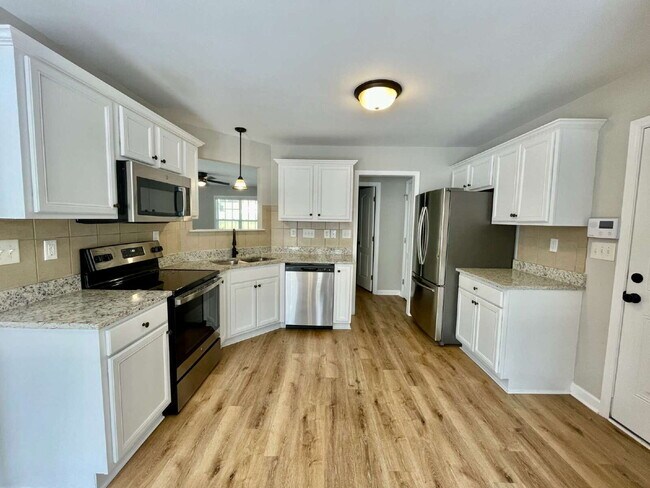 Building Photo - 3-Bed, 2 And A Half Bath Haven With Bonus ...
