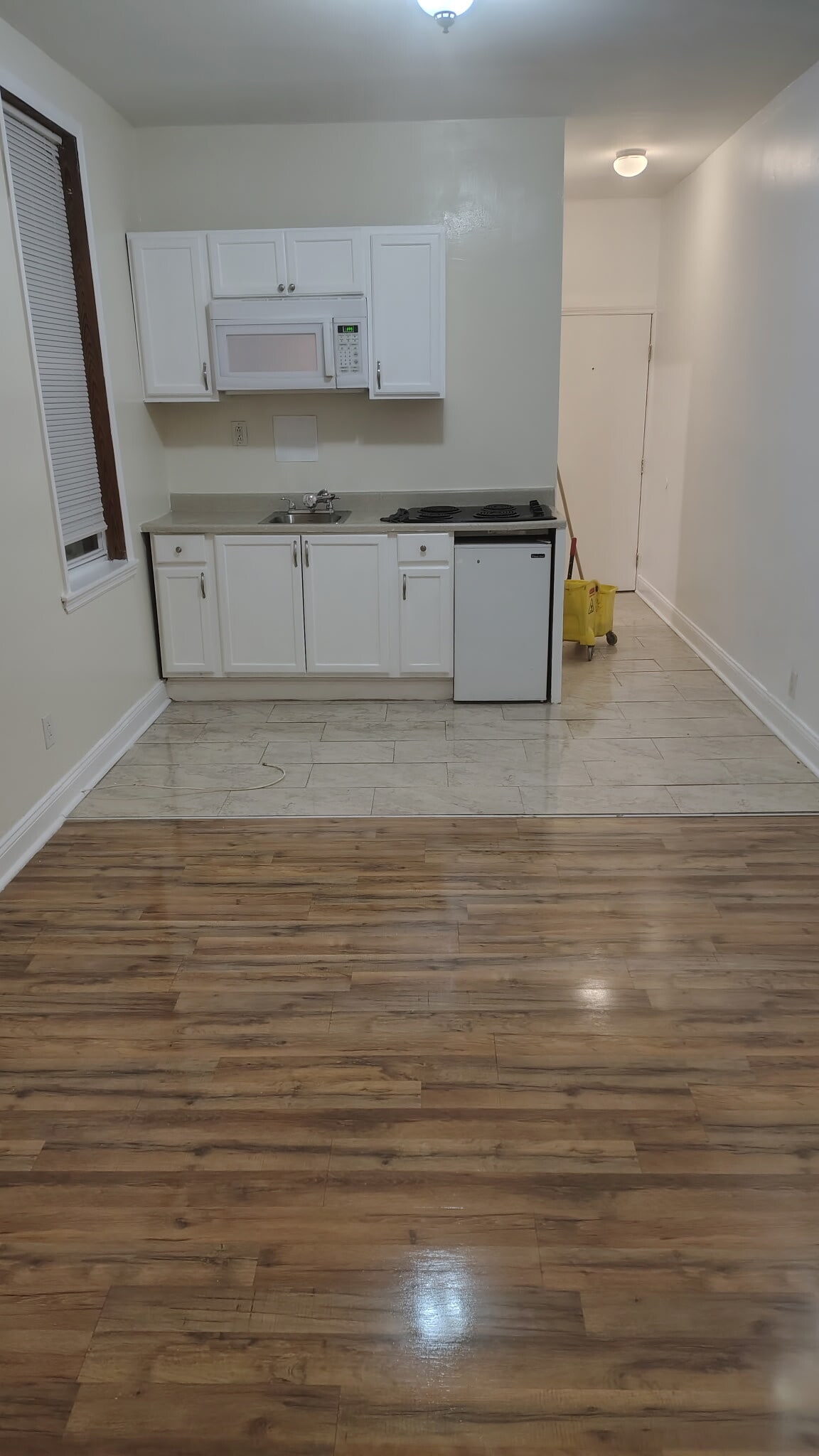 Laminate and tile floors throughout - 5613 Wyalusing Ave