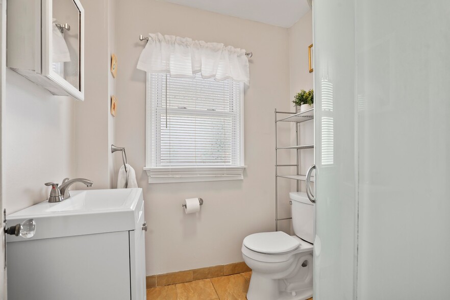 Update bathroom with storage space and shower - 1710 B St